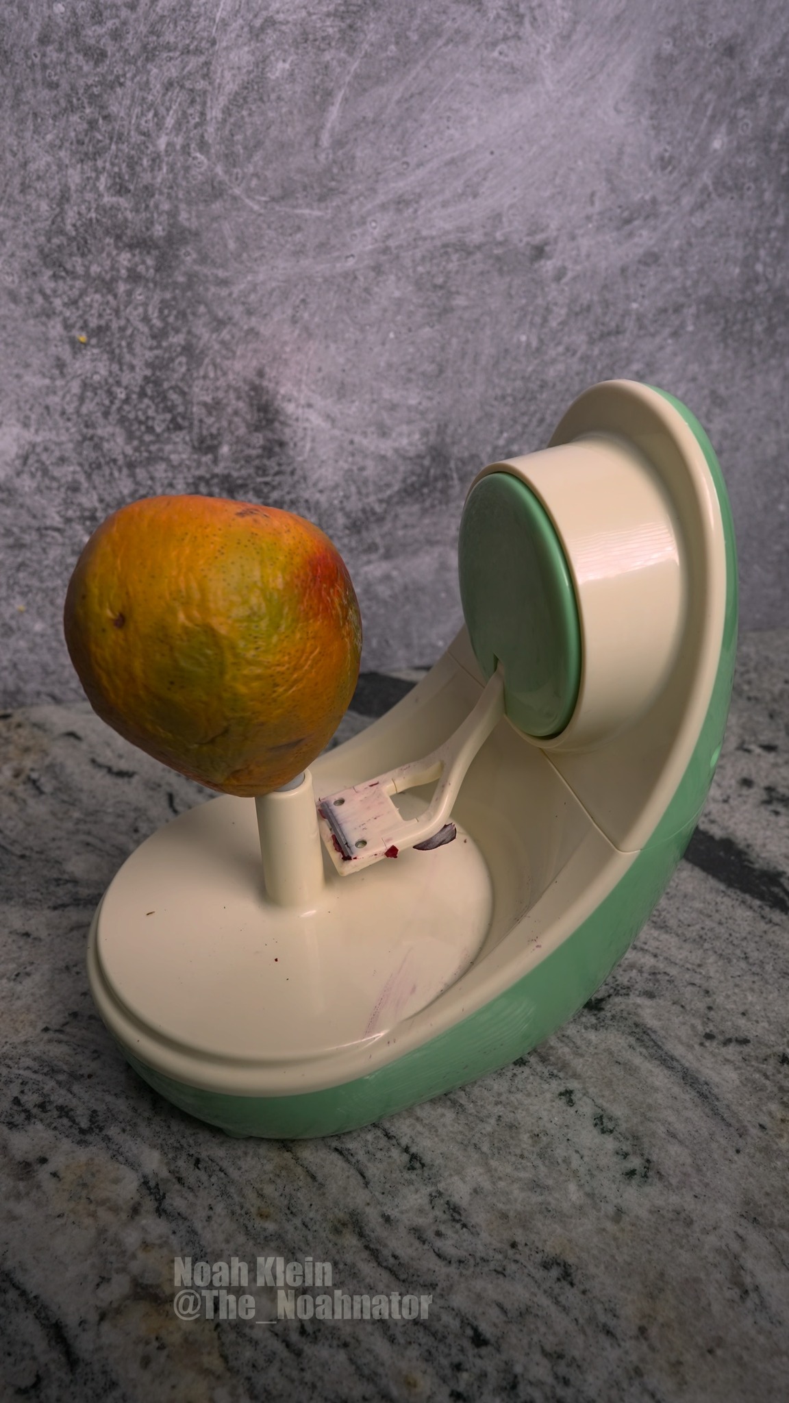 Peeling a ripe mango