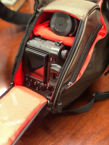 Reviewer's photo of the camera bag in the color Green, open and displaying photography gear