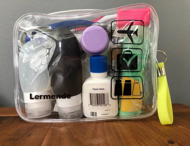 Reviewer's photo of toiletries packed inside a clear TSA-compliant toiletry bag for flying