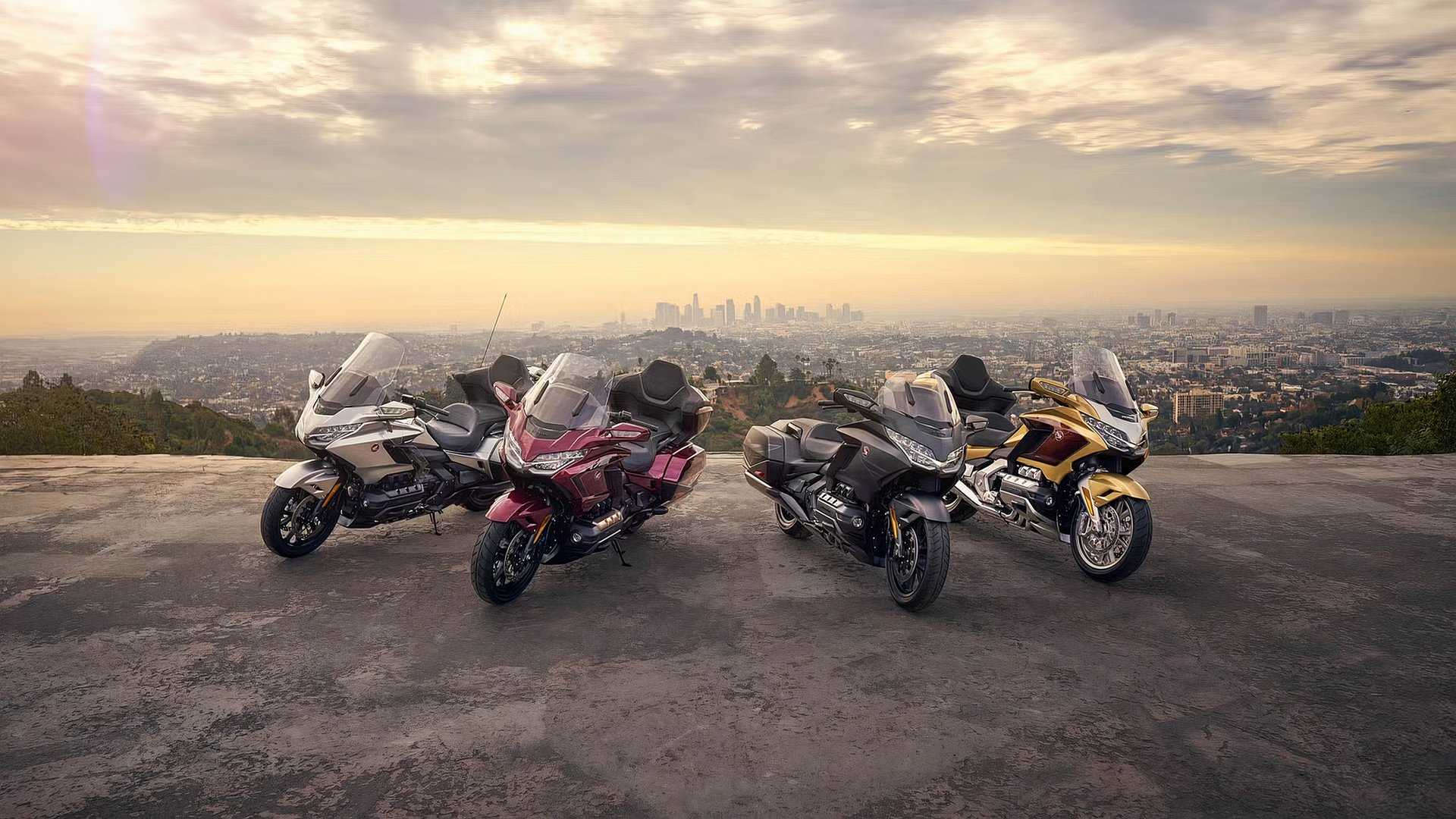 2025 Honda Gold Wing range parked on a bluff overlooking a city