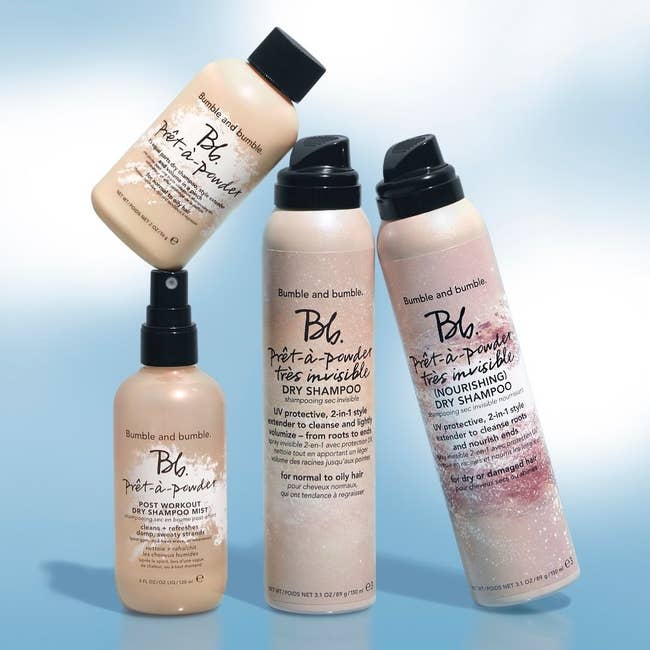 Four bottles of dry shampoo in different formulations, including the powder one