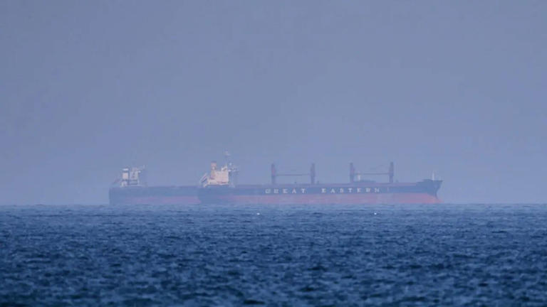 Breaking: Ship catches fire after being hit by unknown projectile near ...