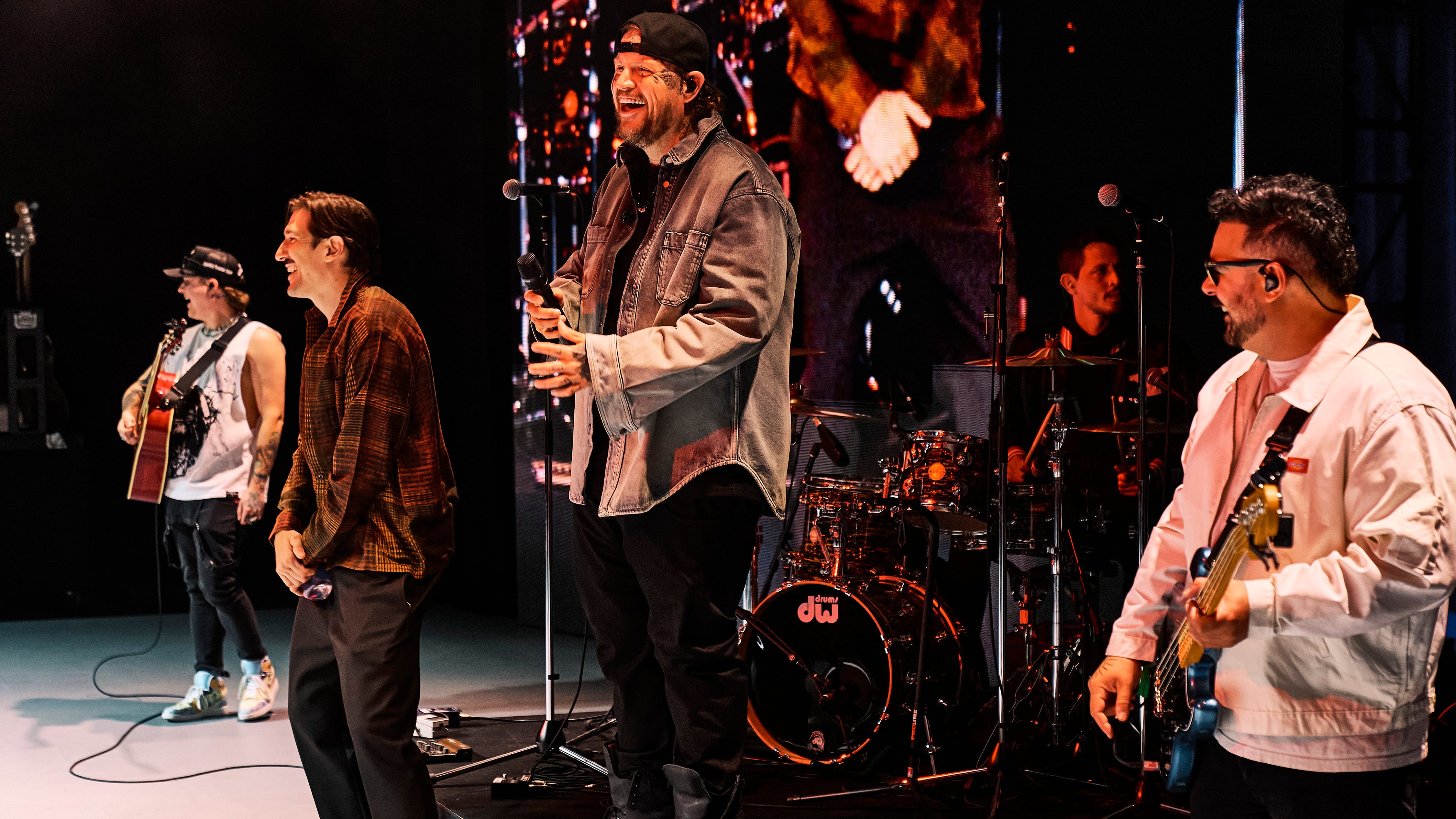 (L to R) Andrew Schulz, Jelly Roll and Tony Hinchcliffe perform onstage at Beautifully Broken Comedy Night: Hosted By Jelly Roll during Netflix Is A Joke Festival at the Greek Theater on May 8.