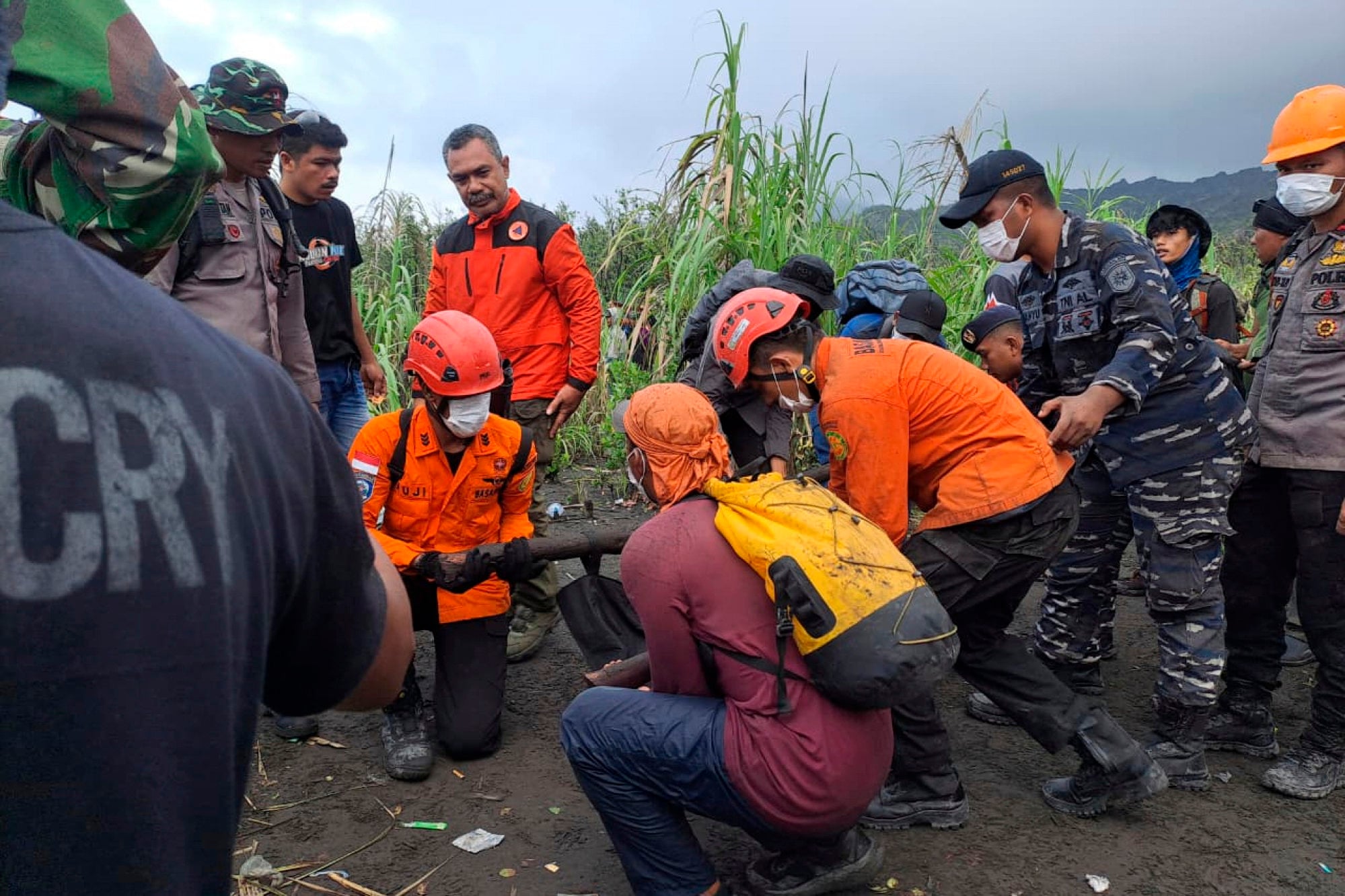 Indonesian rescuers retrieve body of hiker killed in volcanic eruption