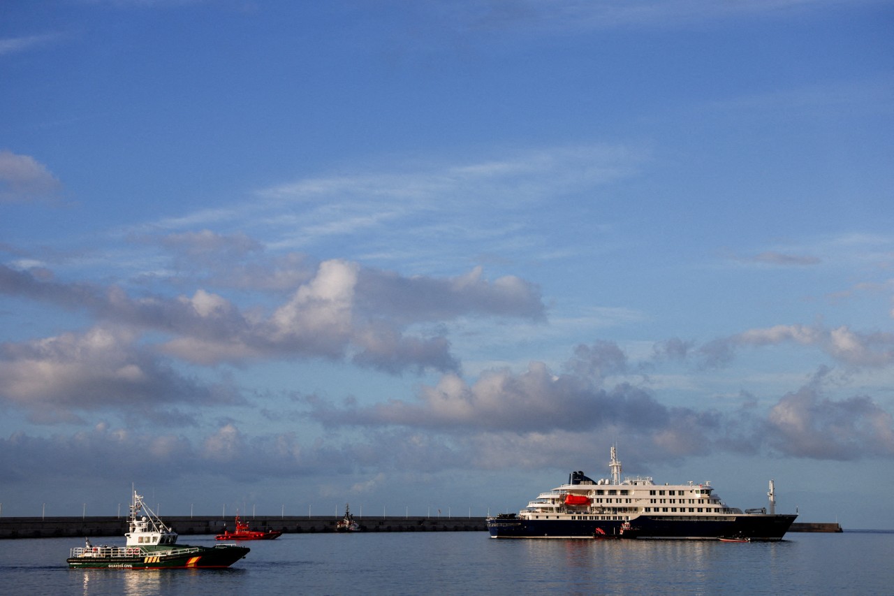 Hantavirus cruise ship reaches port as passengers prepare for repatriation
