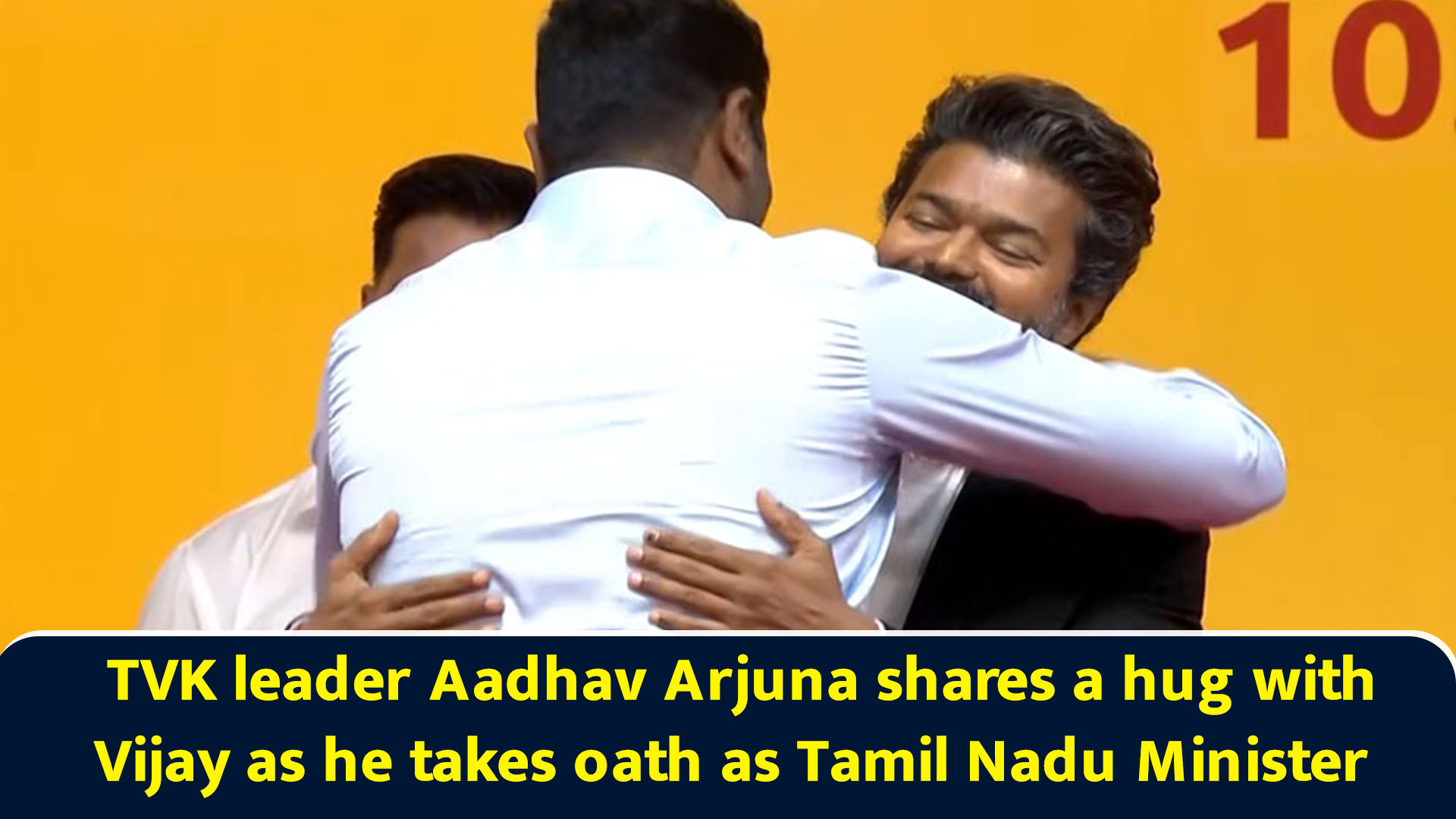 TVK leader Aadhav Arjuna shares a hug with Vijay as he takes oath as ...
