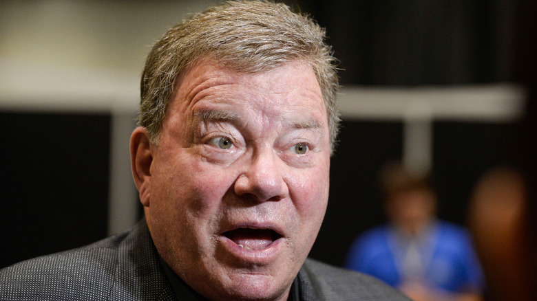 William Shatner speaking with mouth open
