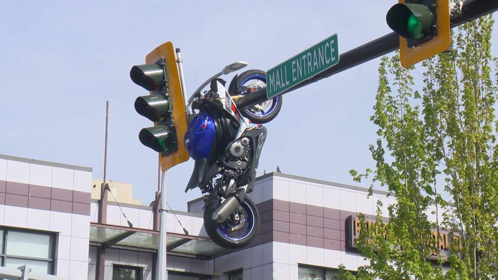 Collision leaves motorcycle hanging from traffic light in Delta, BC