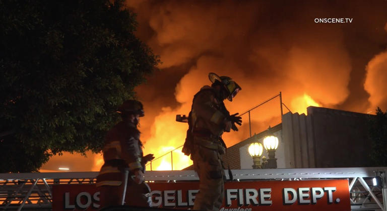 Massive inferno breaks out in downtown Los Angeles as 100 firefighters ...