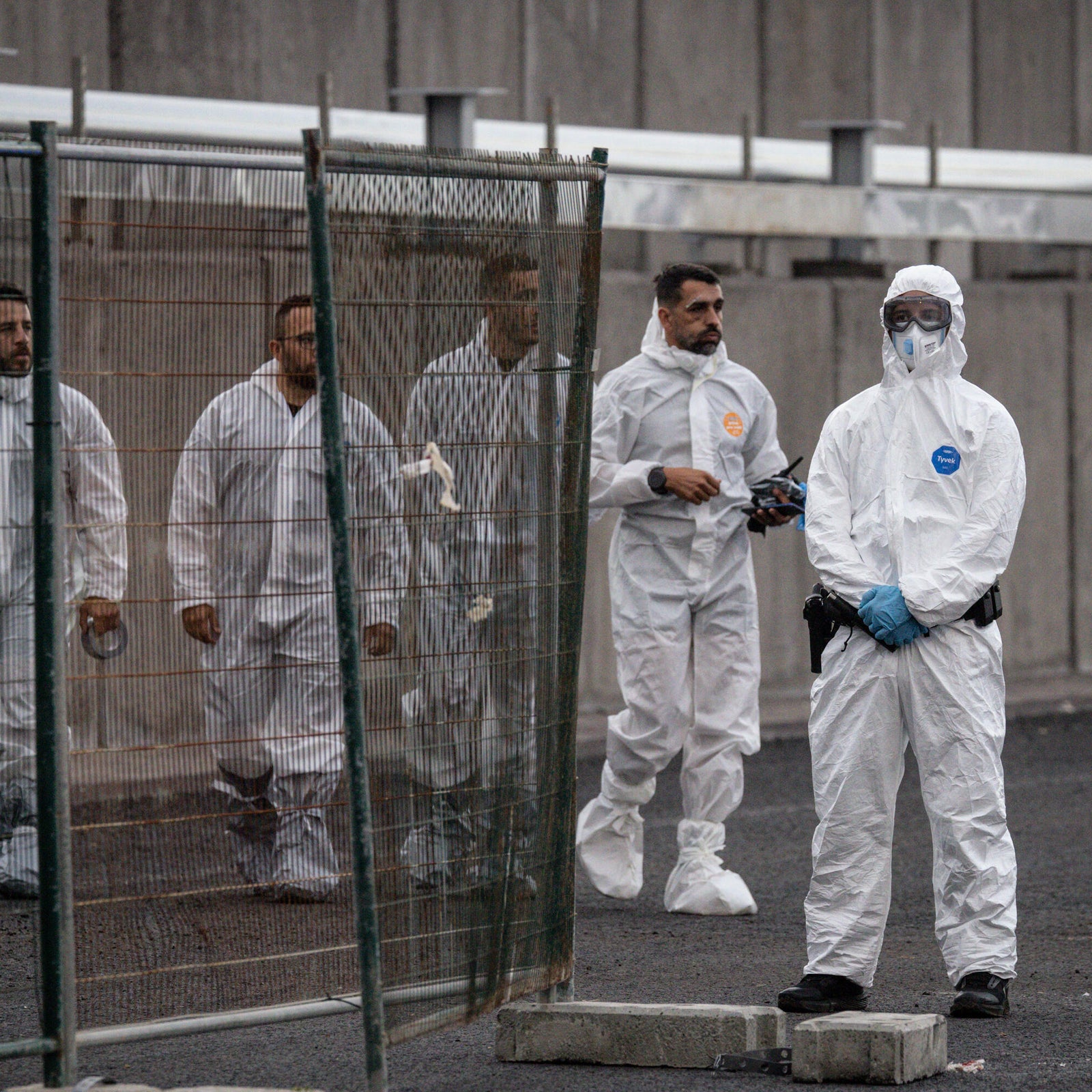 Members of the Guardia Civil stand watch at the expected reception point for passengers from the MV Hondius at the Granadilla Port on May 9, 2026 in Tenerife, part of the Canary Islands, Spain.