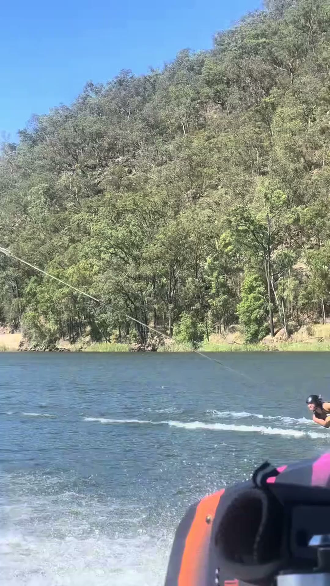 Batwing wakeboard trick on a glassy river