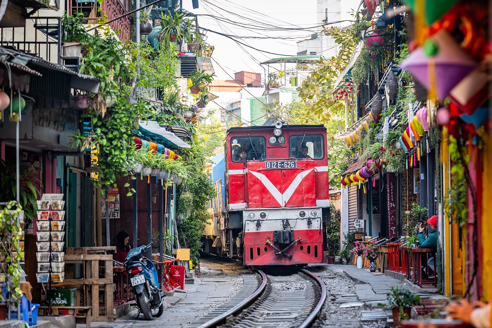 The Vietnamese street where trains pass inches from coffee shops twice ...