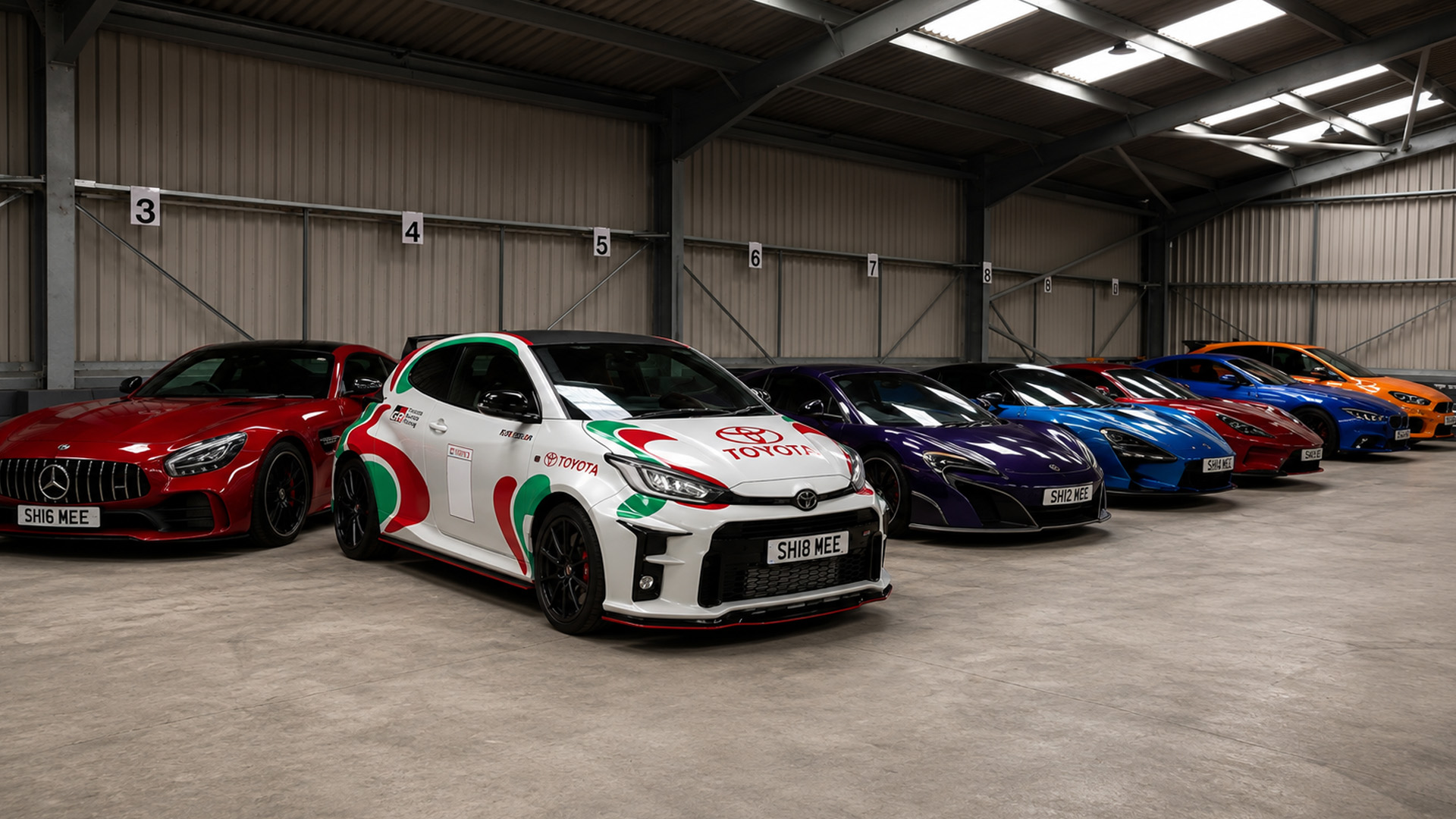 Toyota GR Yaris and supercar collection inside luxury garage