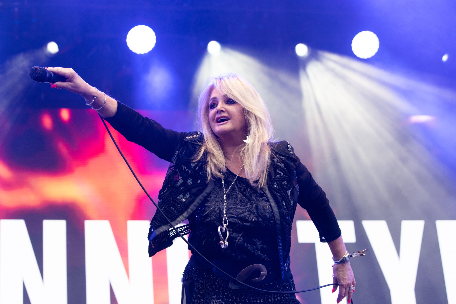 Bonnie Tyler performing on stage