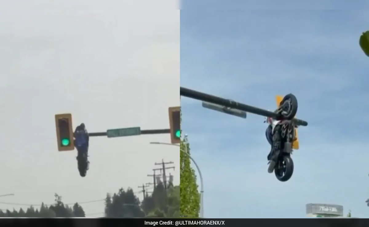 Motorcycle left hanging from traffic light after crash in Canada, rider ...