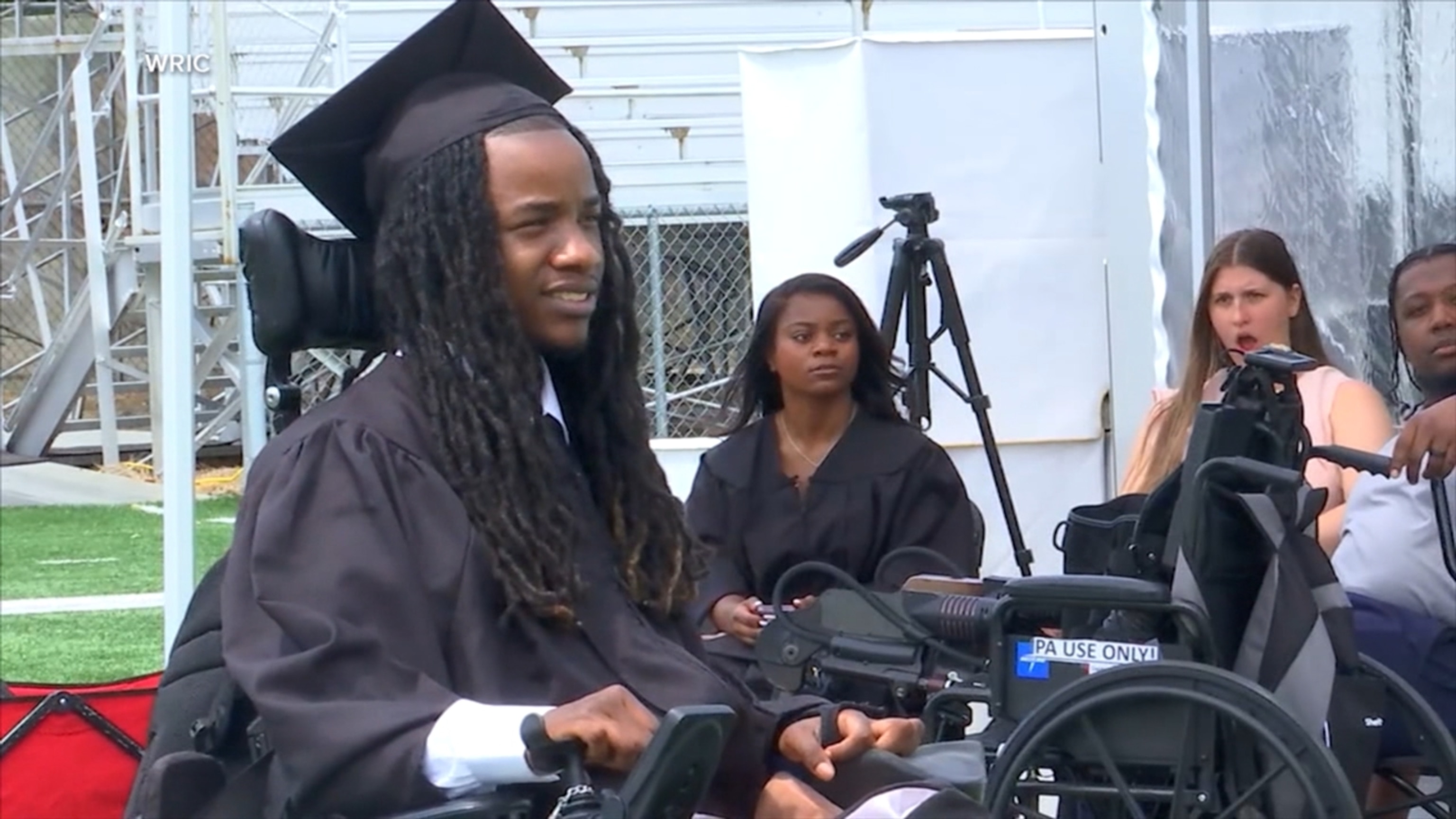 Paralyzed graduate defies the odds