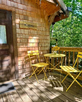 Cozy porch with a wooden wall sign reading