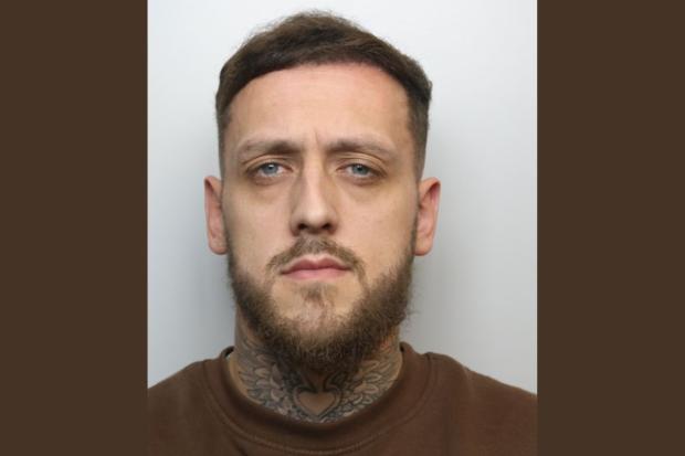 Face of man jailed for stealing thousands from charity