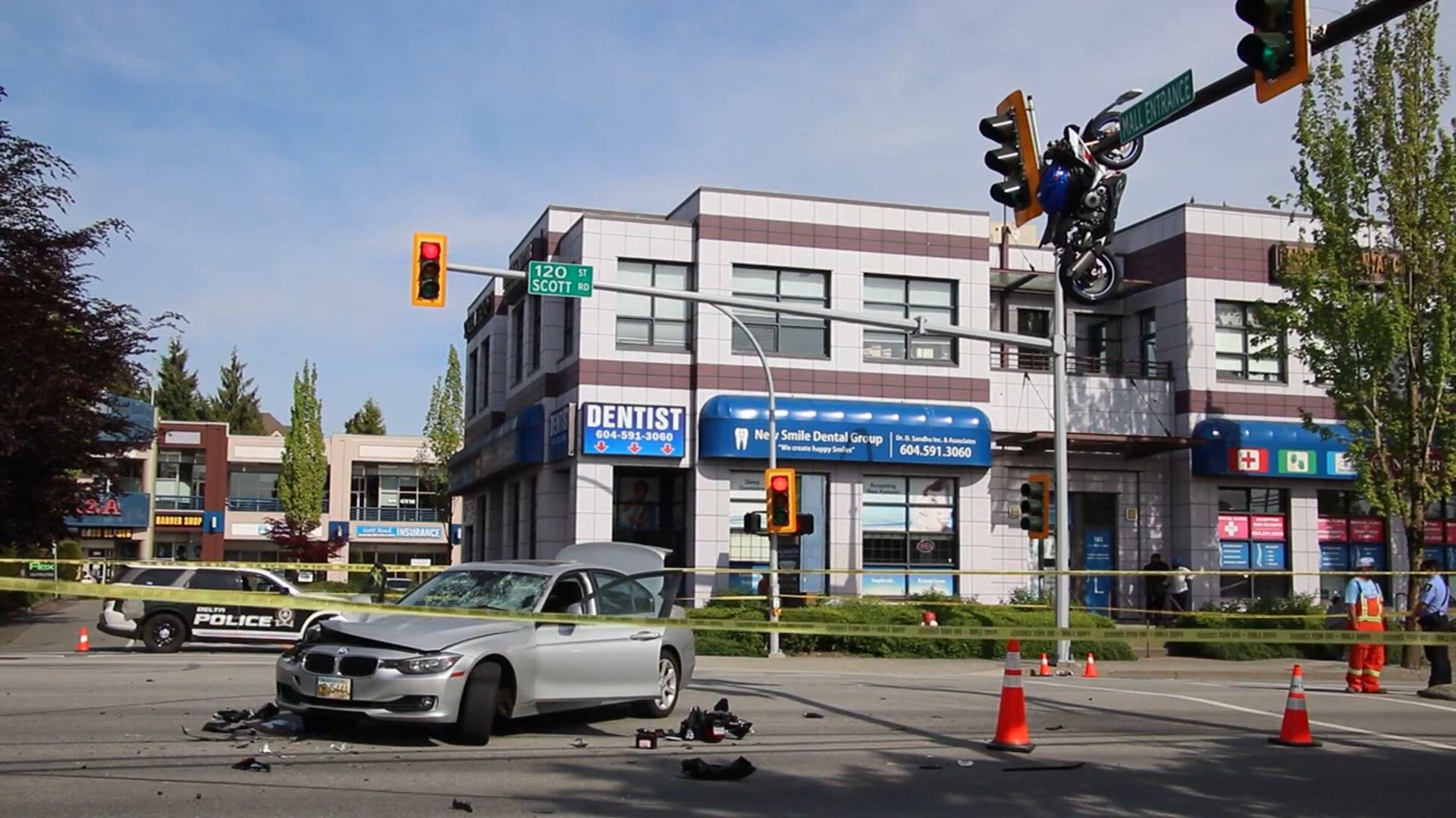 Motorcycle seen dangling from a stoplight after a crash, severely ...