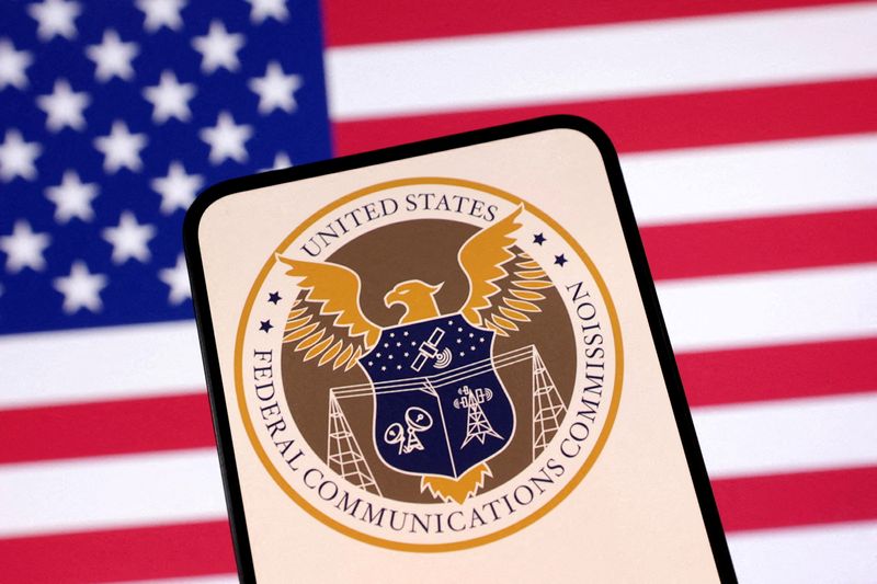 FILE PHOTO: FILE PHOTO: Illustration shows United States Federal Communications Commision logo and U.S. flag