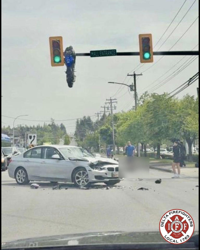 Crash leaves sportbike hanging from traffic light in accidental trick ...