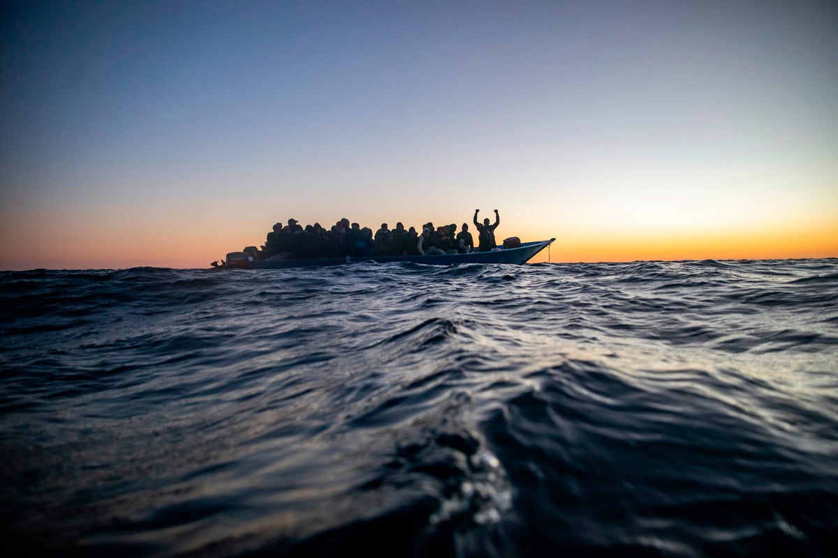 Aid group says Libyan-linked vessels fired on a migrant rescue ship in ...
