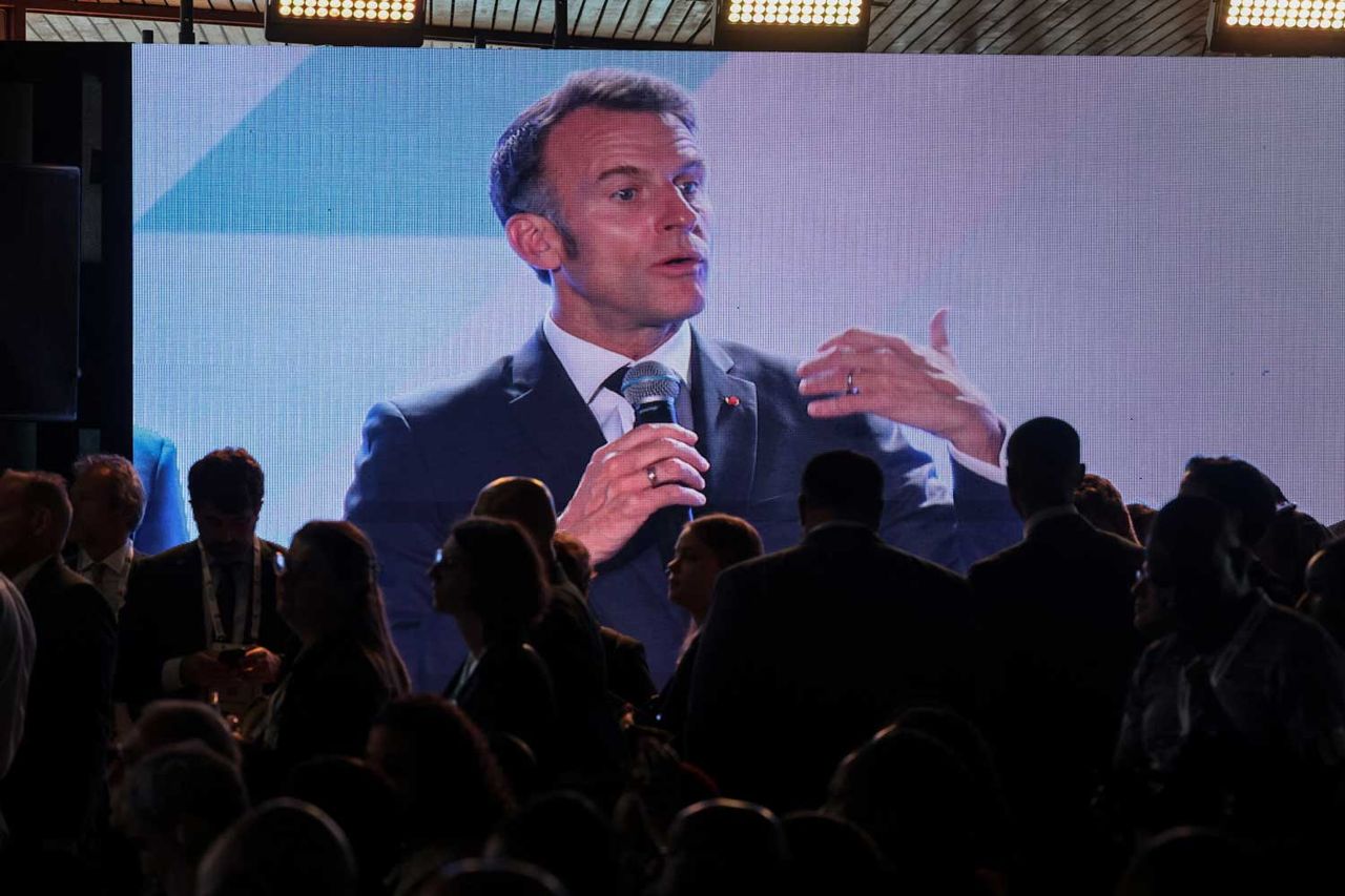 French President Emmanuel Macron grabs microphone, interrupts event to ...