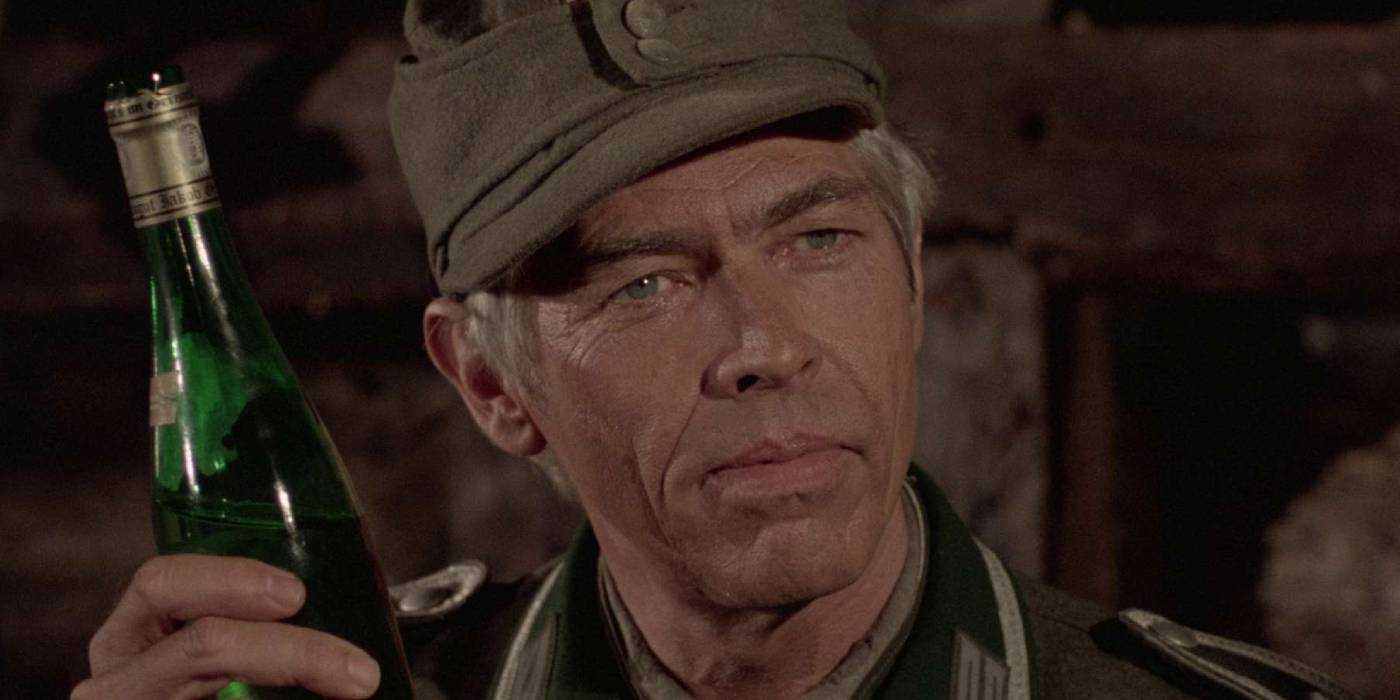 Corporal Steiner holds beer in Cross of Iron