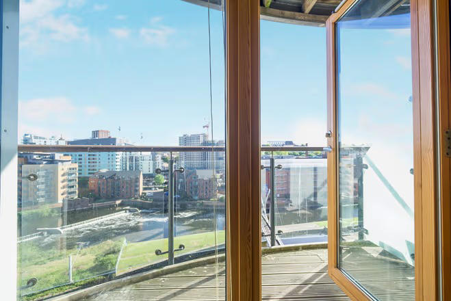 Image showcasing Leeds apartment with river views and balcony hits market for £240k