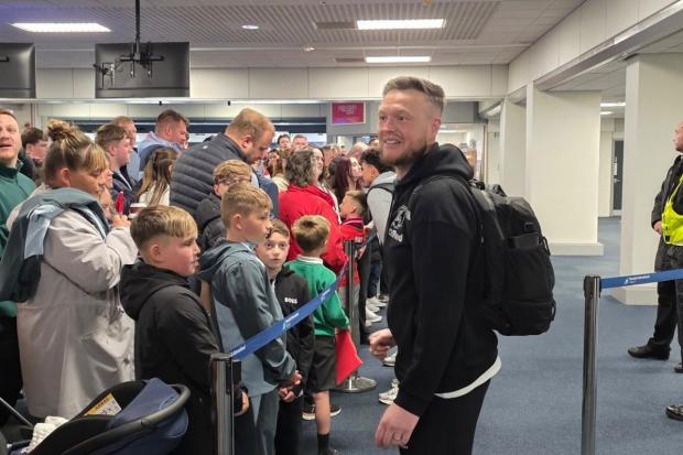Pictures as Boro fans pack Teesside Airport to see off team for play ...