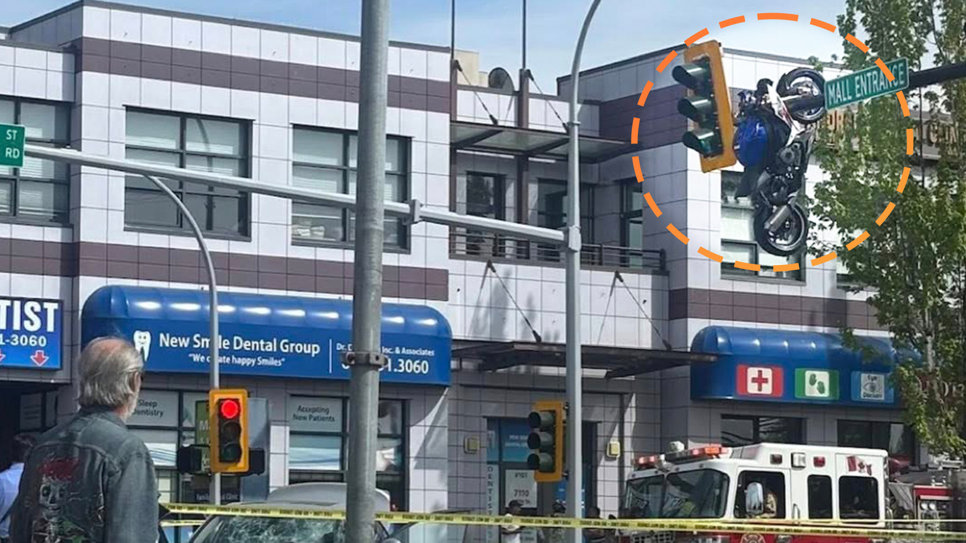 Motorcycle crash leaves bike hanging from traffic light in Delta