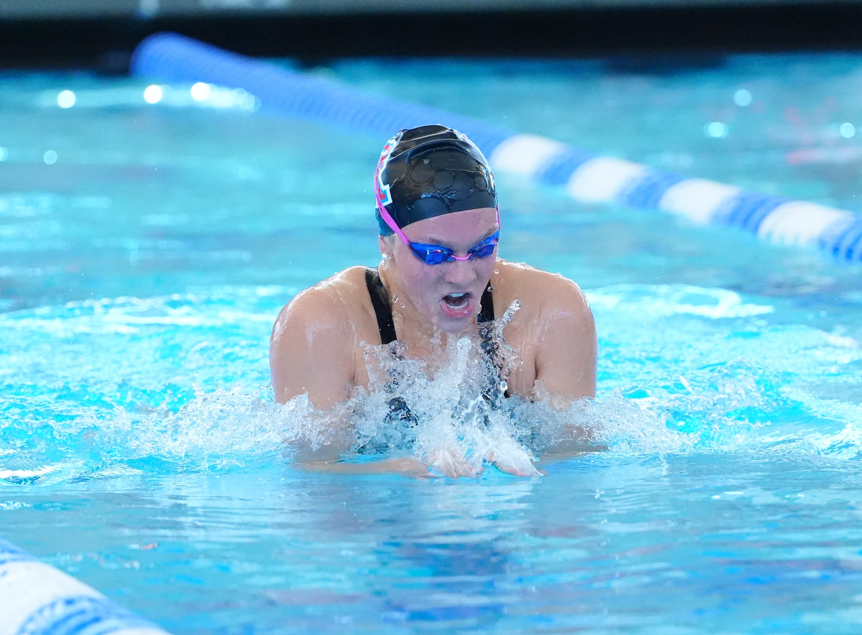Sala wins four events in regional swimming; Manogue takes girls team title