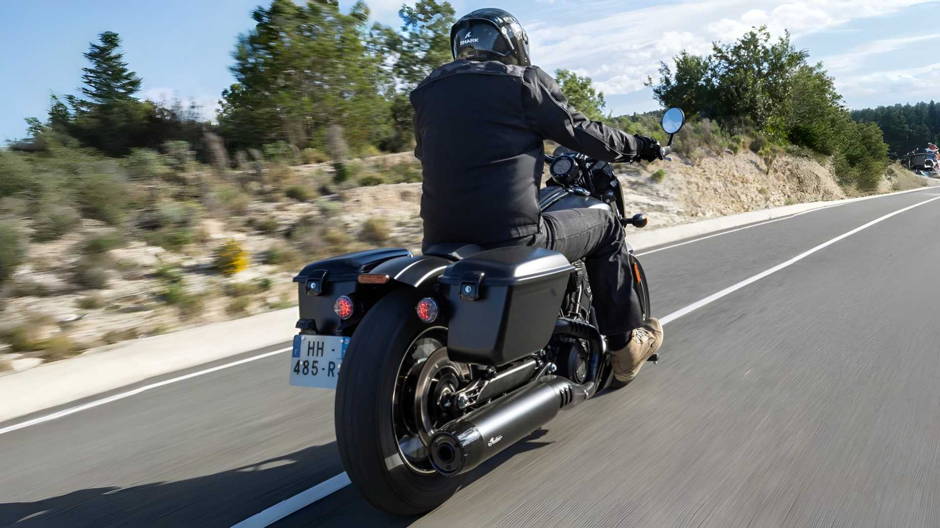 2026 Indian Sport Scout RT in black cruising down the highway rear third quarter view