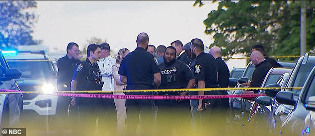 Officers at the scene on Monday, where two were left with life-threatening injuries