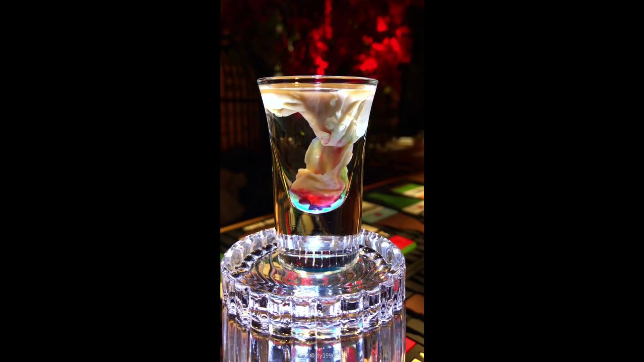 Crafting futuristic brain shot drink with blue red core and white cream ...