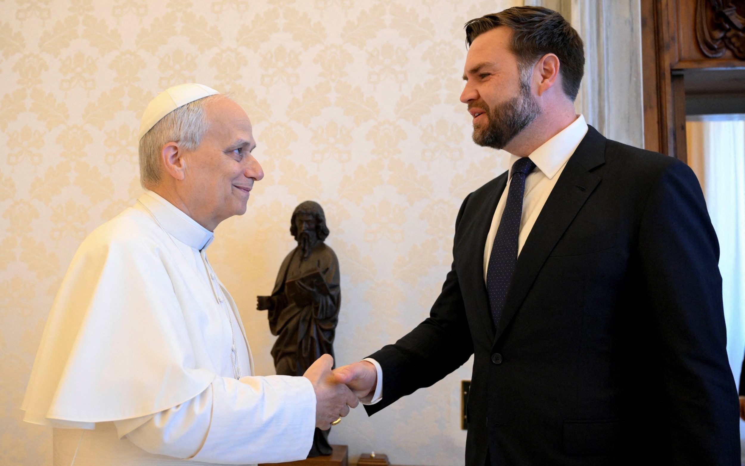 Pope Leo XIV shakes hands with US Vice President JD Vance as they meet at the Vatican