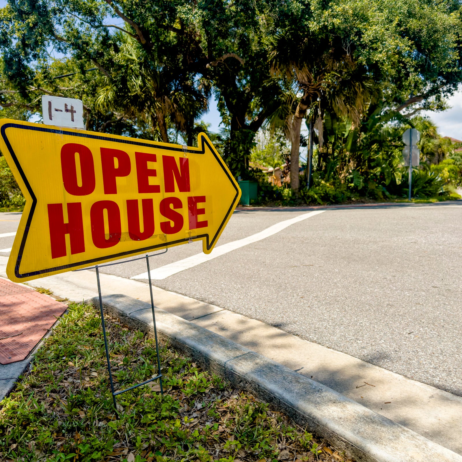 Close up open house sign on sidewalk in Venice, Florida