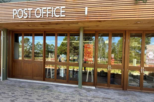 Village post office reopens after move into new shop
