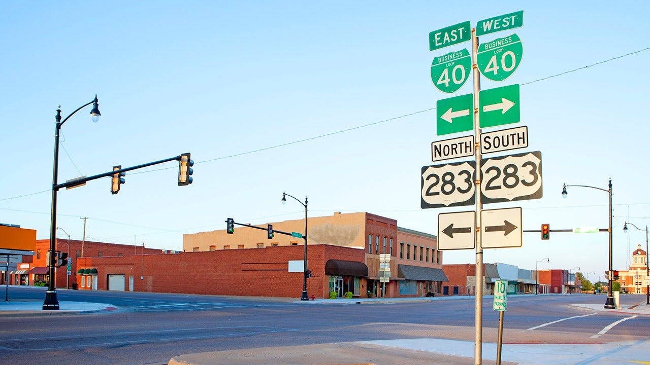The streets and storefronts of Sayre, Oklahoma, appear empty and quiet, reflecting a classic small-town American scene.