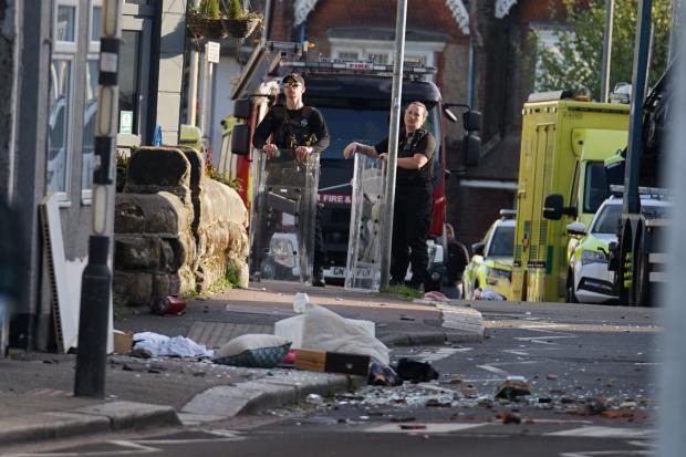 Man named and charged after roof top incident