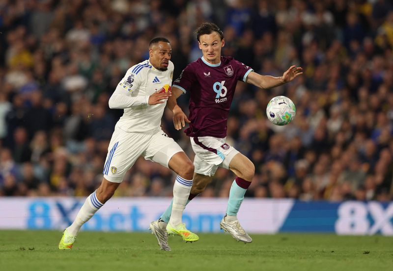 Soccer-Leeds edge closer to Premier League safety after 3-1 Burnley victory