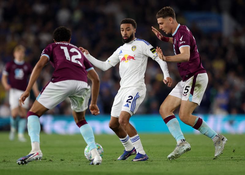 Soccer-Leeds edge closer to Premier League safety after 3-1 Burnley victory