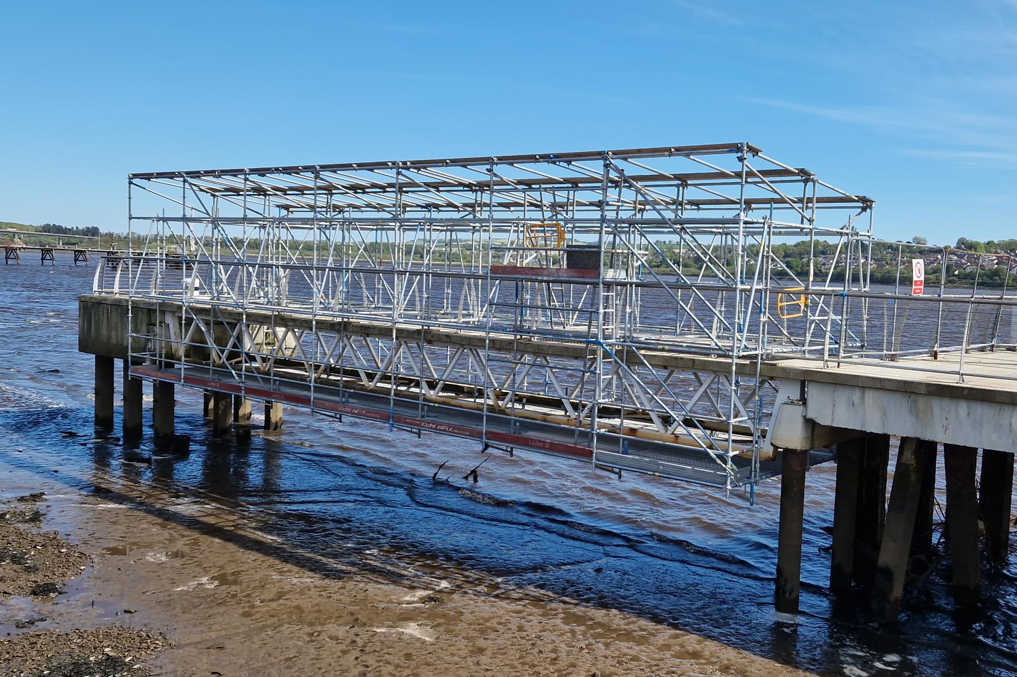 Scaffolding erected and shrink-wrapped for remedial works to jetty on ...