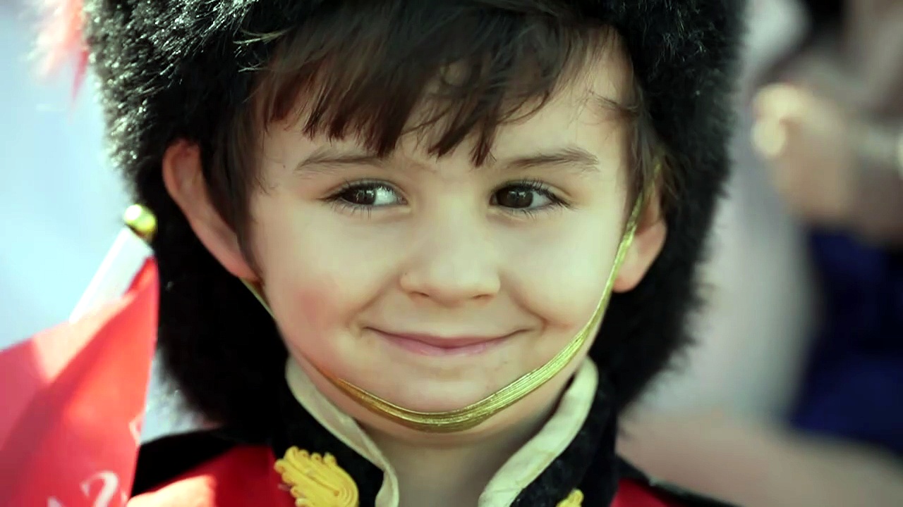 Boy wearing 'cute' Guardsman costume greets the King