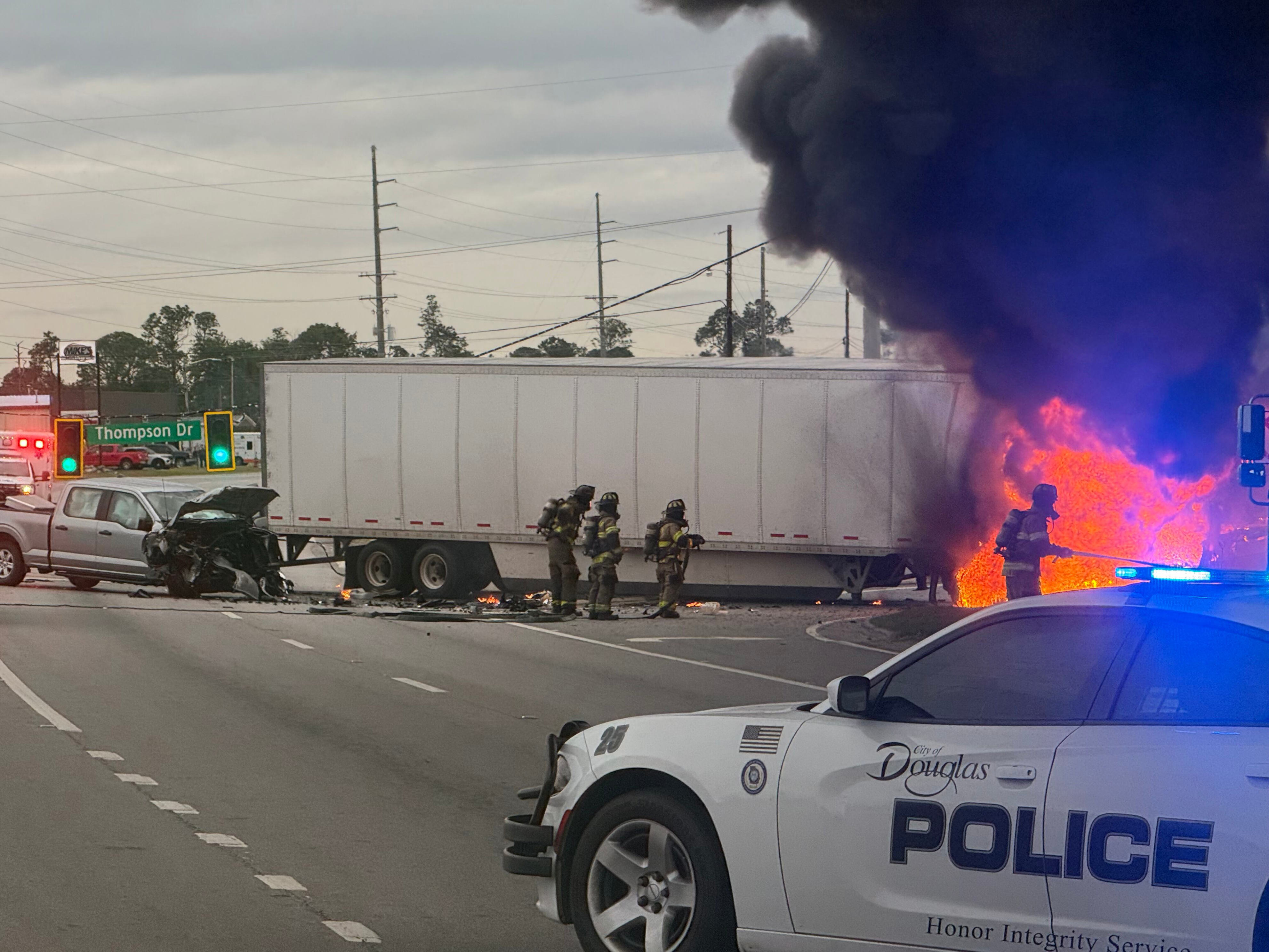 Look: Semi truck catches on fire after crash in Douglas