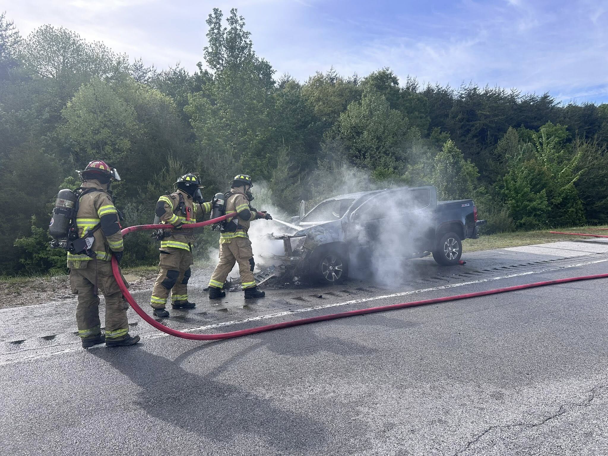 1 injured after pickup truck catches fire while being towed by RV