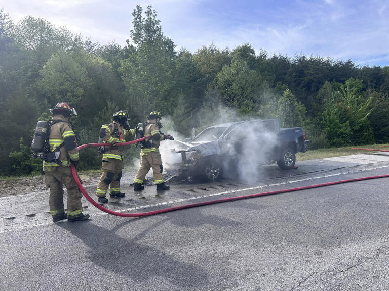 1 injured after pickup truck catches fire while being towed by RV