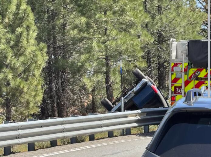Truck flips over side of Mt. Rose Highway