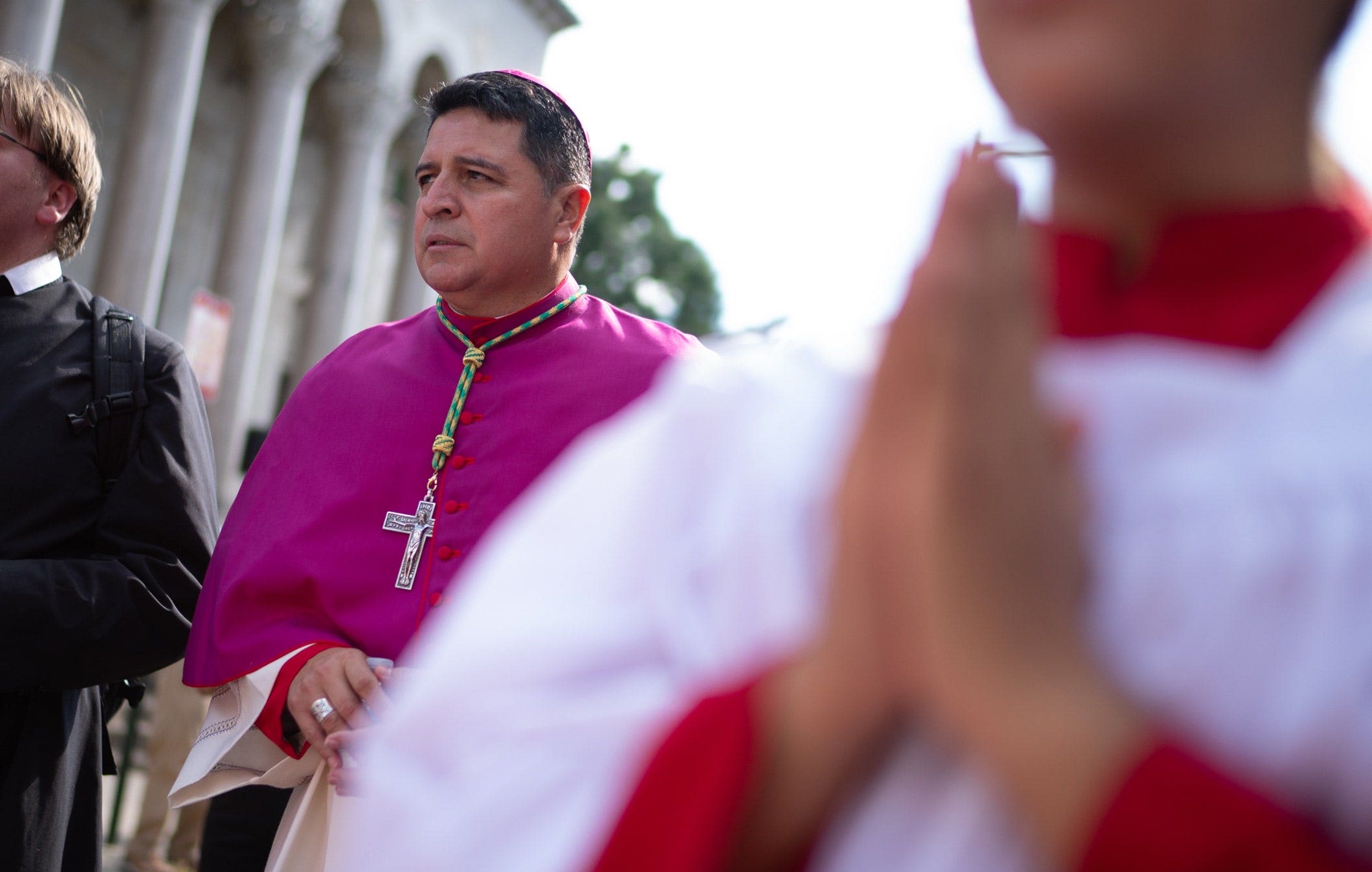 Bishop Evelio Menjivar-Ayala walks at the front of the procession of the 111th World Day of Migrants and Refugees in Washington.
