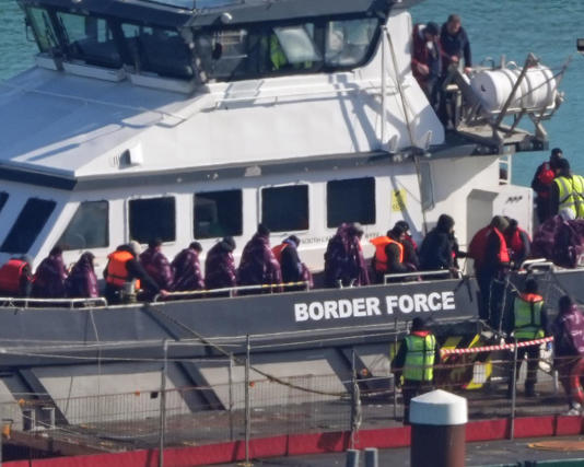 People being brought into Dover by a Border Force vessel after a small boat incident in the Channel. The man arrived in the UK in a small boat and was sent back to France last November. Photograph: Gareth Fuller/PA